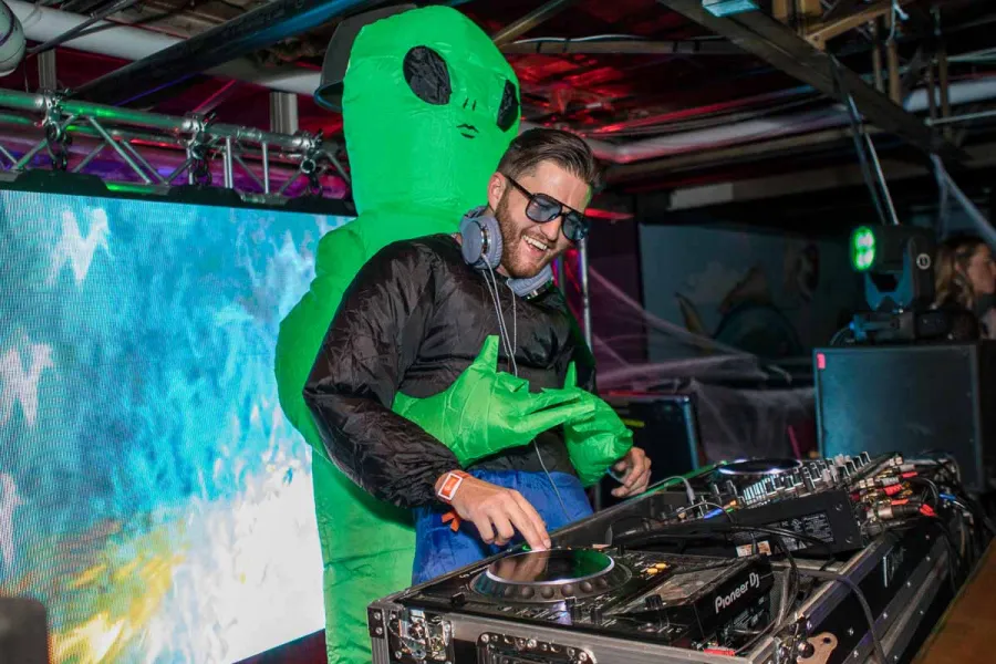 Hot T in the DJ booth at Coloween 2025