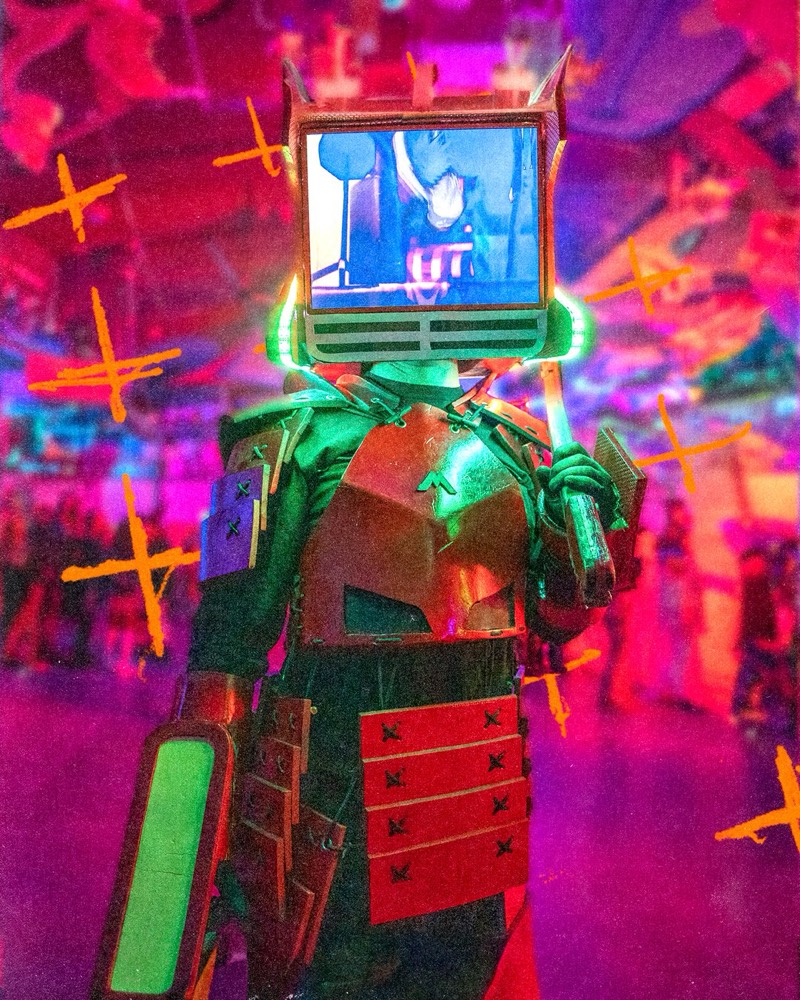 TV-headed samurai in LED-trimmed armor stares down the lens at Denver's Coloween Halloween party