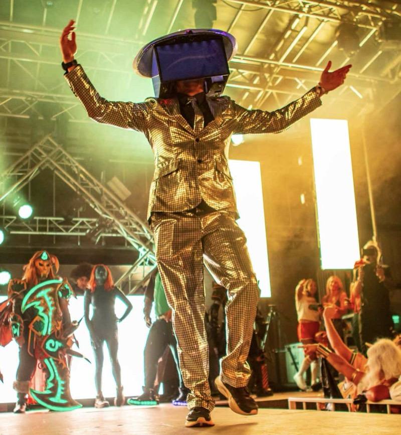 Mirrored gold suit and TV helmet strutting the costume-contest runway