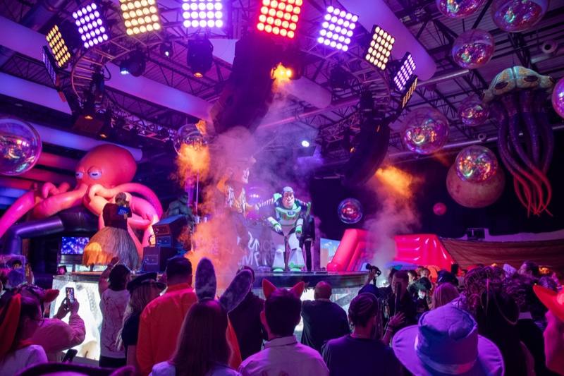 Fog rolls over the main stage under LED grids, jellyfish, and disco balls at Coloween, Denver's 21+ Halloween party